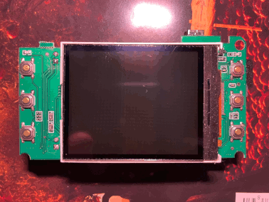 Photo of the camera's circuit board, showing the LCD and push buttons