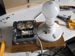 Photo of a partially assembled dim-bulb tester, now being wired with a grey electrical cord