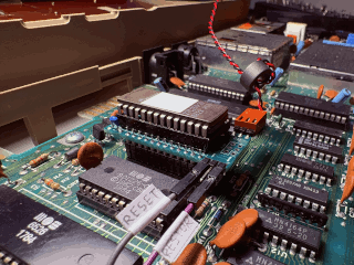 Kernal switcher installed on Commodore 64 mainboard, side view